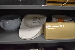 Three vintage chamber pots and an impressively large stone hot water bottle.