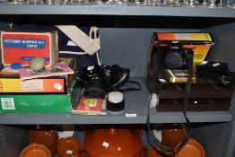 A selection of photographic and camera equipment including Nikon M90 film camera and Canon EOS 100