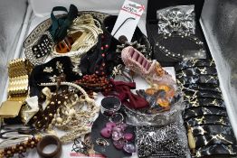 A selection of fashion items including hair slides, head bands, skull buckle, ring holder, bow ties,