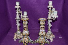 Two vintage ceramic candle sticks having cherubs to base and floral decoration AF, also included are