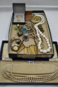 A selection of modern and vintage costume jewellery including triple string of simulated pearls, hat