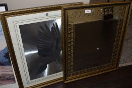 A retro wall mirror having leaf motif to border and a framed dove foil picture.