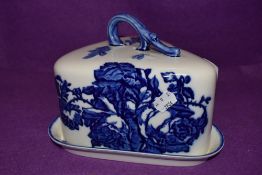A ceramic cheese dome by Blakeney with blue and white transfer design base and cover both good