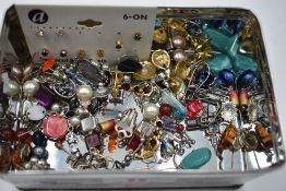 A selection of costume earrings of various designs