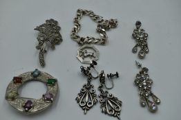 A small selection of white metal jewellery including a curb link bracelet and charm stamped 925/