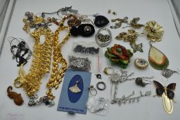 A selection of costume jewellery including brooches, earrings, Napier gold plated necklaces, etc
