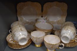 a part tea service by Tuscan china with a pink and gilt design
