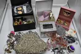 A selection of costume jewellery including earrings, pins, evening bag etc