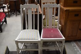 A set of three painted dining chairs, mixed seats