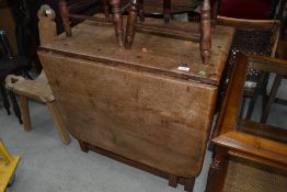 A traditional craftsman made gateleg dining table with exposed joints etc