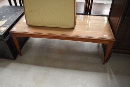 A vintage mid century teak coffee table