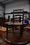 A traditional rush seated ladder back chair