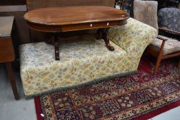 A traditional chaise longue having vintage yellow paisley cotton cover