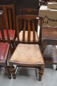 Two arch backed dining chairs