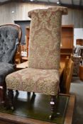 A Victorian prie dieu (prayer) chair, having later upholstery
