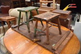 Two traditional stools, part stripped