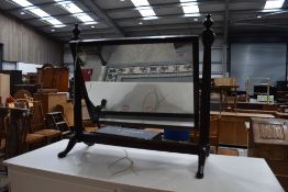 A traditional mahogany dressing table mirror, probably early 20th Century and a strung footstool