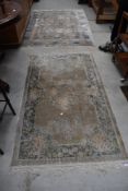 Two oriental style silk fireside rugs, approx. 156 x 92cm and 183 x 120cm