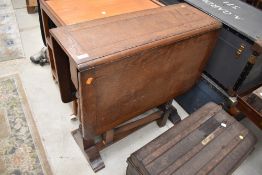 A drop leaf oak dining table approx 106cm x 76cm when open