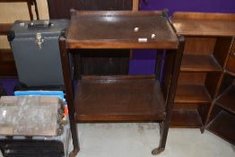 An early 20th Century dark stained oak tea trolley