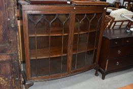 An early 20th Century mahogany display cabinet, on ball and claw feet, width approx. 120cm