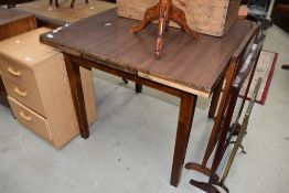 An early to mid 20th Century formica topped drawer leaf table