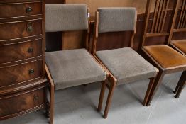 Two vintage upholstered dining chairs