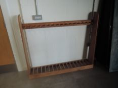 A pine free standing upright Gun Rack, spaces for 17 guns, width 142cm, height 122cm
