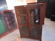 A mahogany and glazed free standing upright Gun Cabinet, spaces for 8 guns, width 96cm, height
