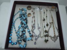 A tray of vintage costume jewellery including yellow wire and bead necklaces, wire spider brooch,