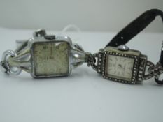 A lady's continental silver cocktail watch by Bucherer stamped 800 having a baton numeral face in