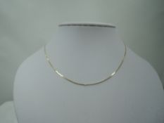 A yellow metal snake link chain stamped 9K, approx 20' & 2g