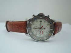 A gent's automatic wrist watch in the Corum Admiral style having a baton numeral dial with three