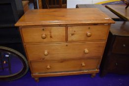 A stripped pine chest of two over two drawers, width approx. 91cm