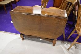 An early to mid 20th Century oak twist gate leg table of narrow proportions, approx 91 x 32cm closed
