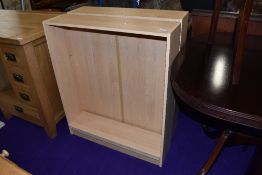 A pair of laminate beech effect bookshelves