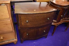 A stained frame bow fronted chest of two deep drawers , width approx. 61cm