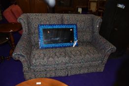 A vintage settee in floral upholstery