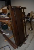 A traditional oak double bed frame, with irons, linen fold decoration