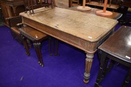 A traditional stripped oak library table on reeded legs, approx. 153 x 77cm, split to top