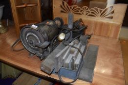 A bench grinder, vice etc
