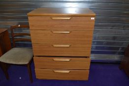 A vintage laminate (teak effect) bedroom chest of five long drawers, width approx. 77cm