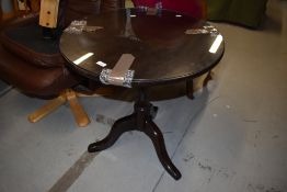 A solid wood Victorian mahogany tilt top tea or wine table
