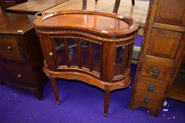 A reproduction display cabinet of kidney shape having tray top, width approx. 73cm