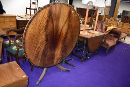 A reproduction Regency fold over circular dining table, diameter approx. 122cm