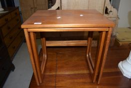 A vintage teak nest (two tables only), labelled McIntosh