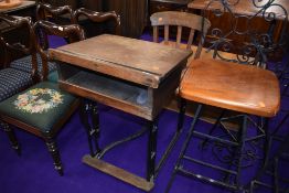 An early 20th Century school desk and chair, oak and cast iron frame