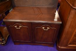 A mahogany effect low cupboard