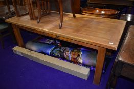 A good quality light stain refectory kitchen dining table with frieze drawers
