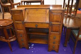 A 1930s oak bureau with side by side cupboards and book shelf under, nice proportions, width approx.
